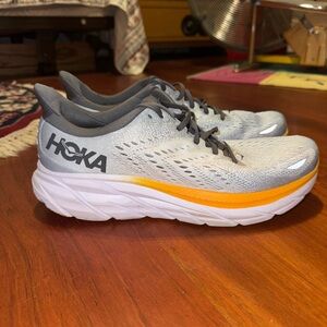 Hoka Light Gray and Vibrant Orange Sneakers